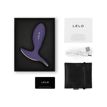 Contenido de la caja LELO SURFER 2 con plug anal vibrador morado, cable USB, bolsa de almacenamiento y tarjeta de garantía